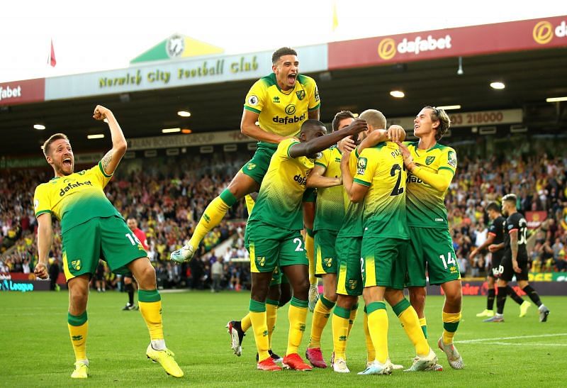 Norwich rejoice after scoring against Manchester City.
